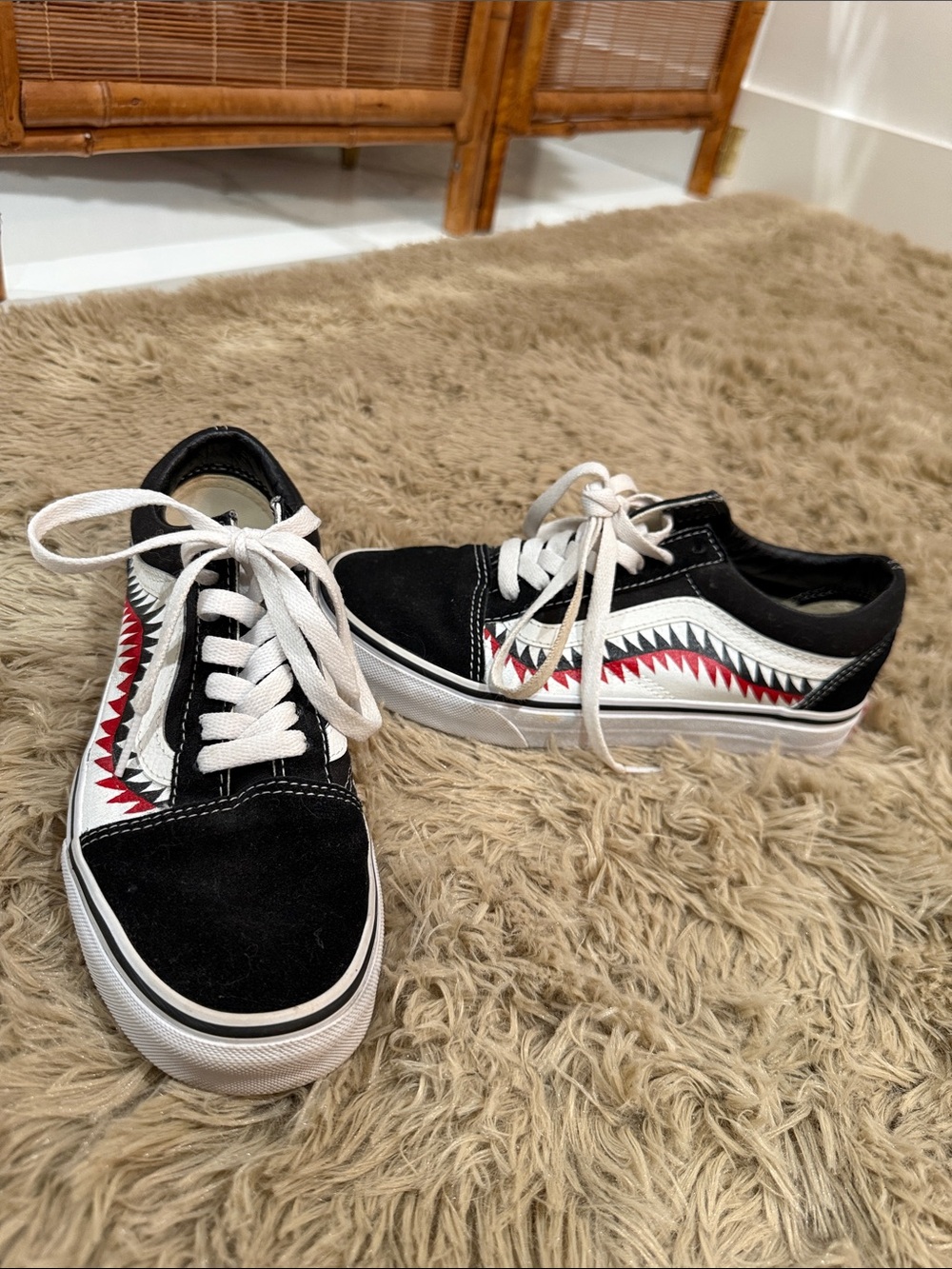 Vans Black Low-Top Sneakers with Red and White Shark Tooth Stripe